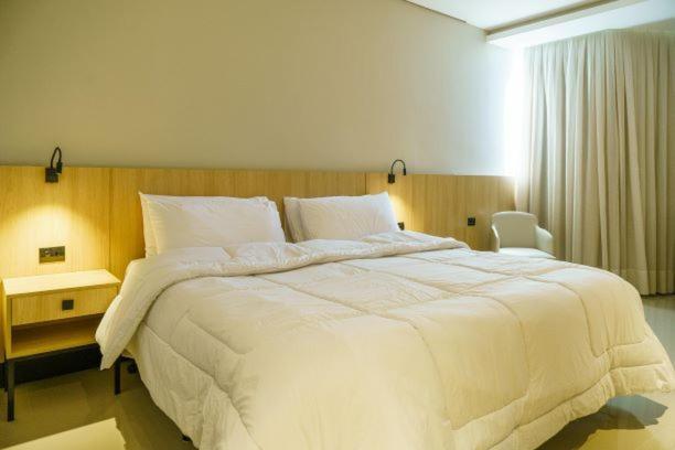 Quarto Premium com Cama de Casal ou 2 de Solteiro