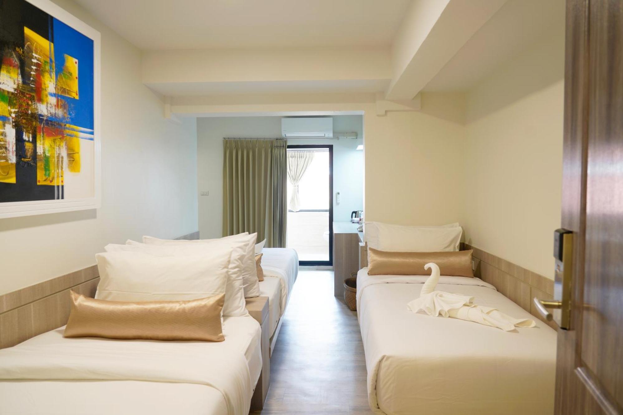 Quarto Triplo Deluxe com Janela