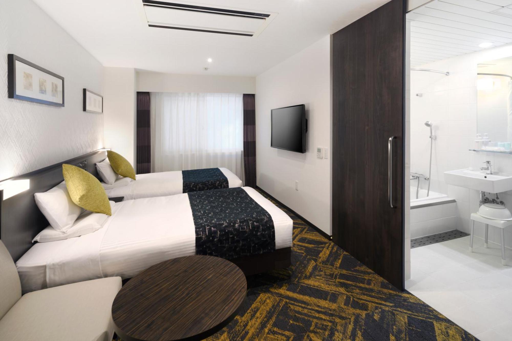 Quarto deluxe com 2 camas de solteiro - Térreo - Não Fumantes