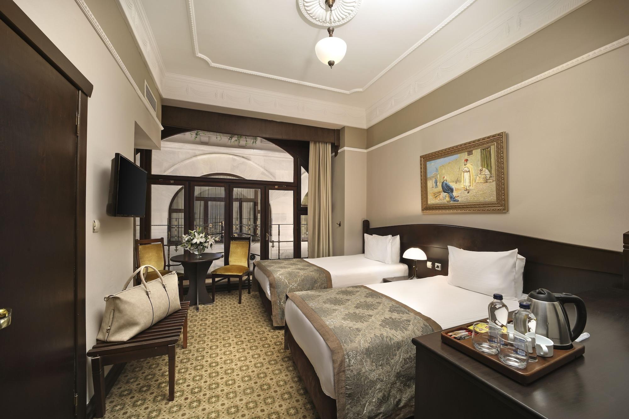 Kamer met Kingsize Bed of 2 Aparte Bedden en Uitzicht op het Atrium