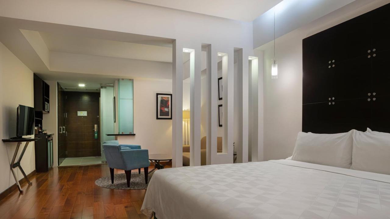 Suíte com Cama King-size e Acesso ao Lounge