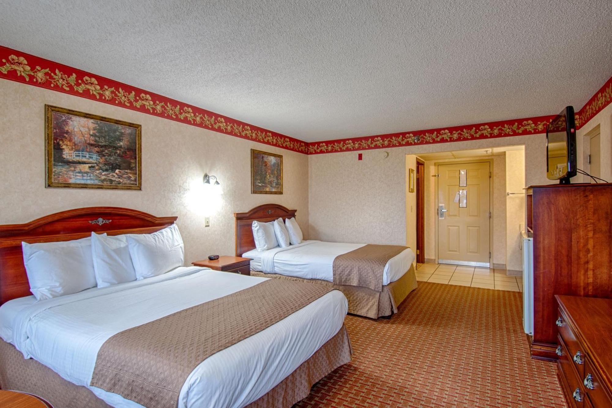 Quadruple Room with Two Queen Beds and Balcony - Non Smoking/Interior Corridor