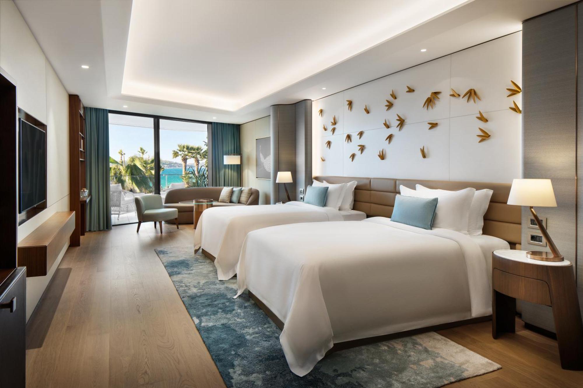 Zimmer Reges Retreat mit 2 Doppelbetten, Balkon und Meerblick