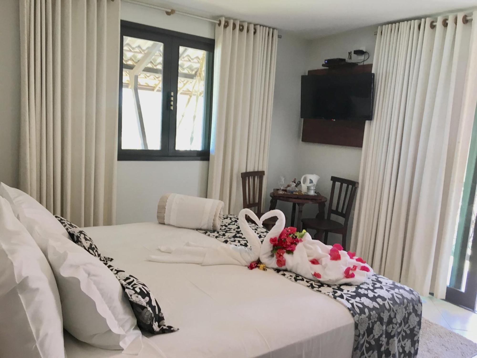 Quarto Duplo Deluxe com Varanda e Vista Lateral do Mar