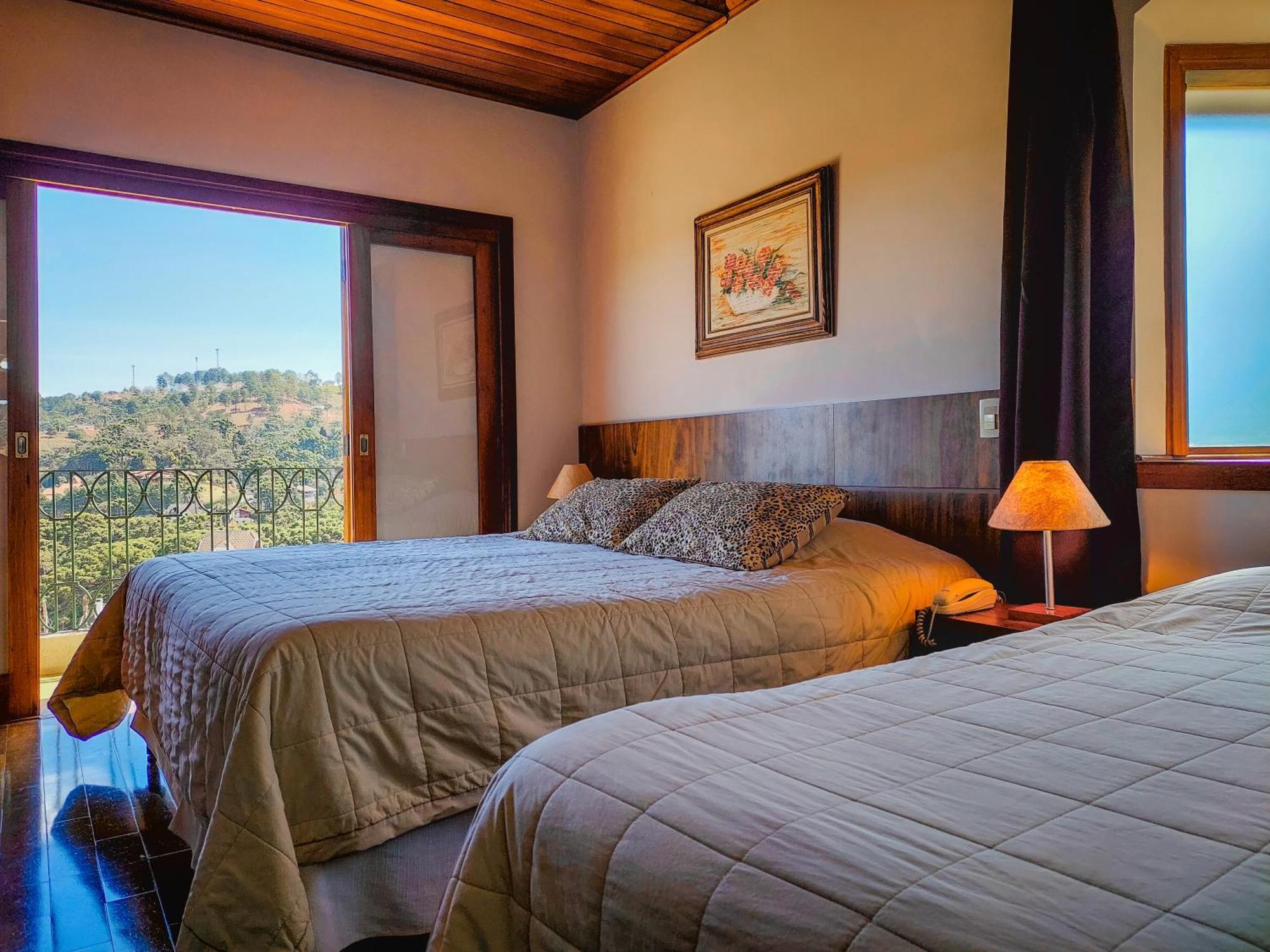 Quarto triplo de luxo com vista da montanha