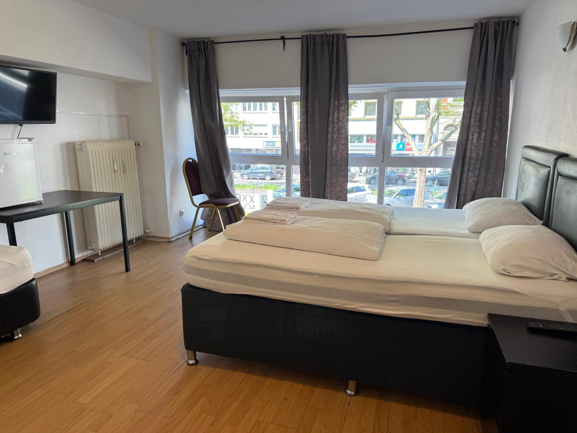 Comfort Dreibettzimmer mit Gemeinschaftsbad