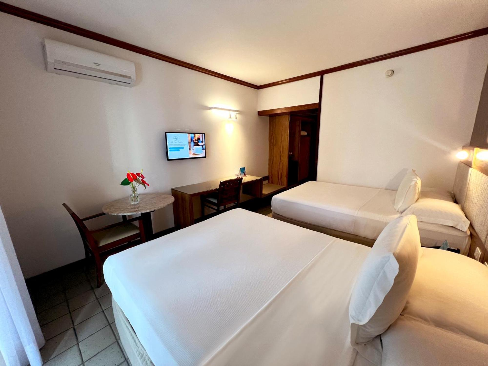 Quarto clássico com 2 camas de solteiro