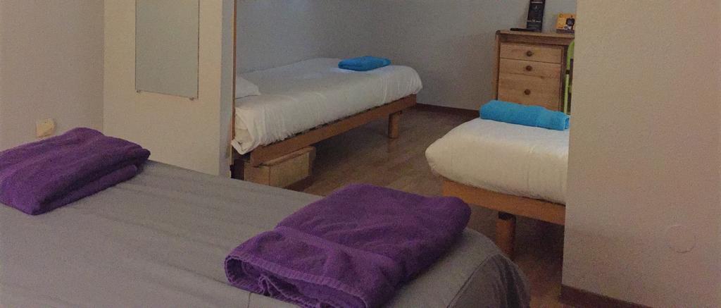 Chambre Quadruple avec 1 Lit Double et 2 Lits Simples