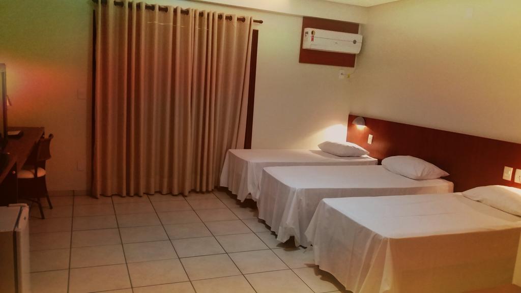 Quarto Triplo Deluxe com Varanda