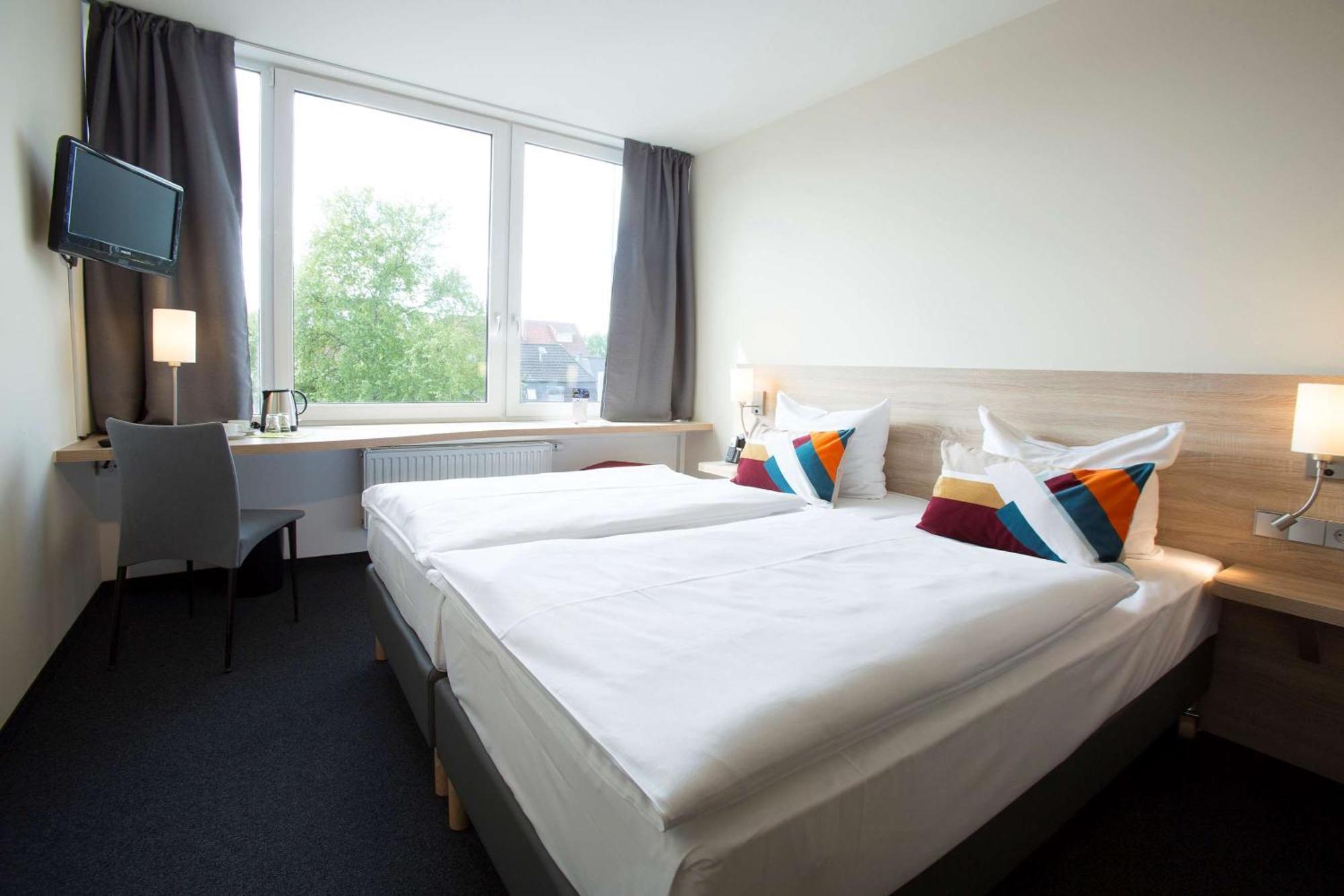 Doppel- oder Zweibettzimmer