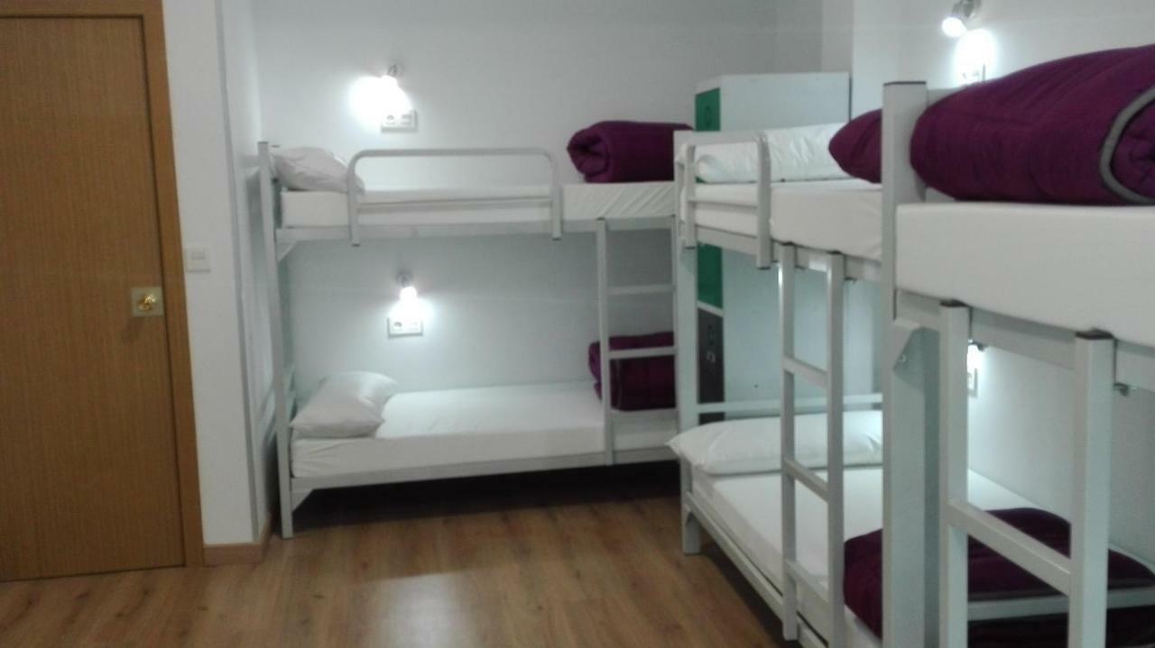 Cama en habitación compartida de 8 camas