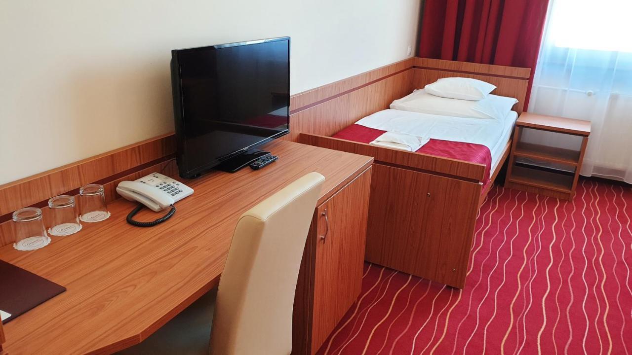 Quarto Triplo Standard com 3 Camas de Solteiro