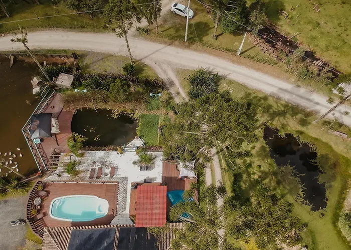 Suítes Pousada Jardim do Buda com café e piscina Urubici